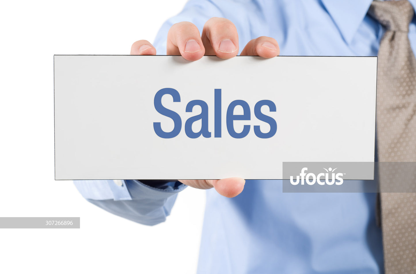 Businessman holding sales sign stock photo