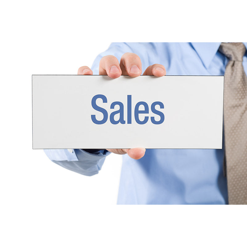 Businessman holding sales sign stock photo
