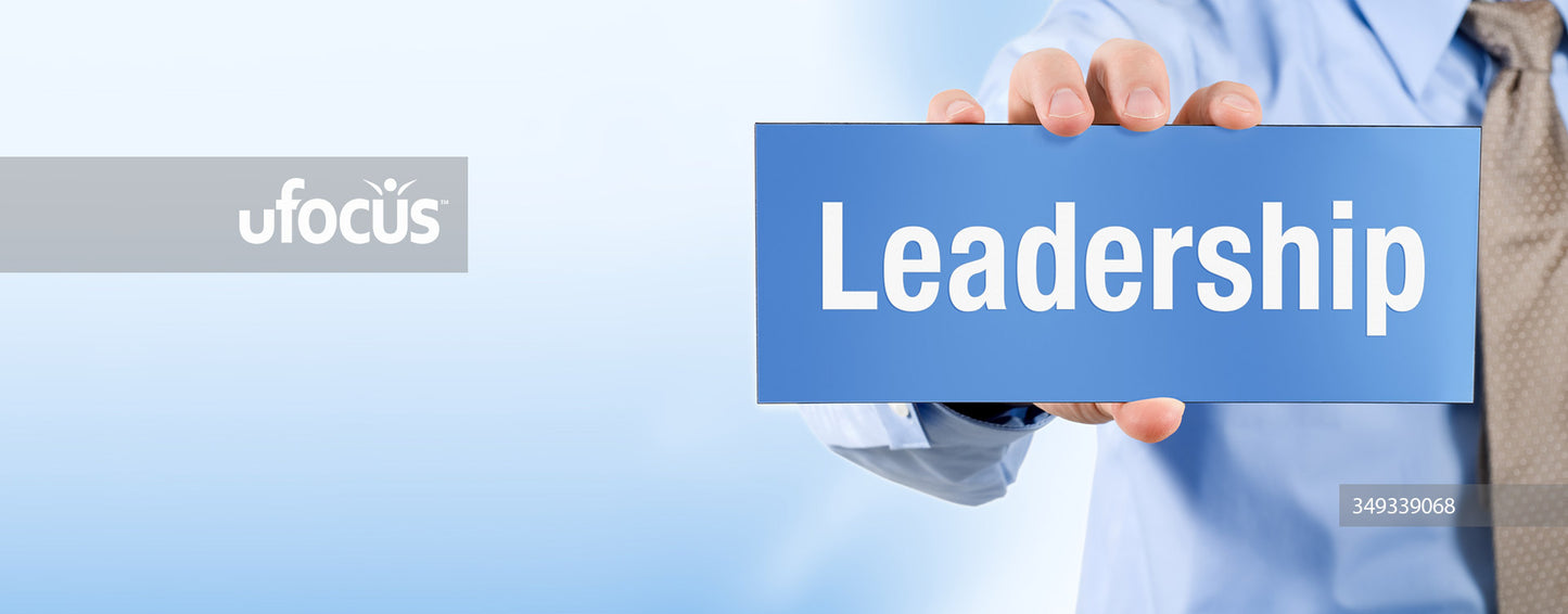 Businessman holding leadership sign banner stock photo