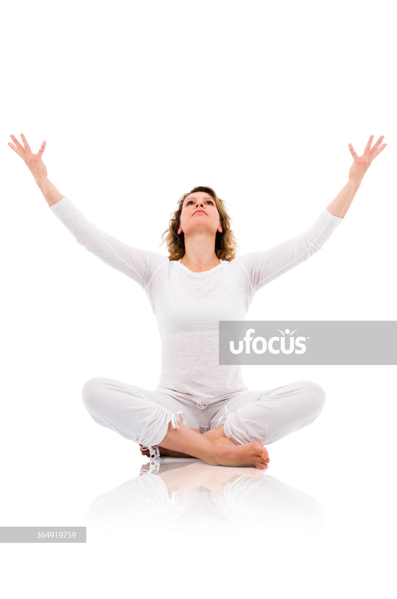 Young woman practicing yoga and meditation stock photo