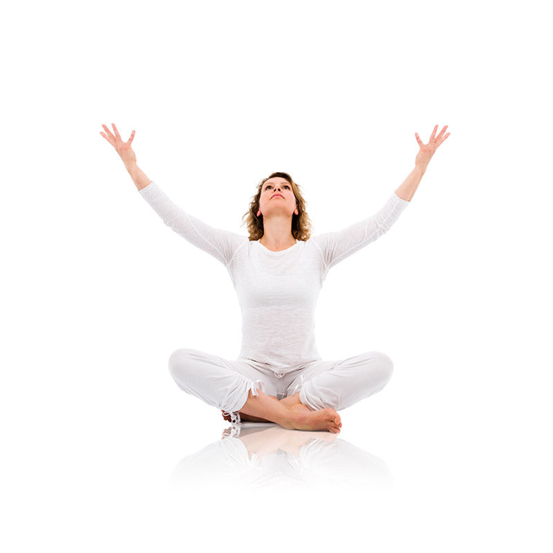 Young woman practicing yoga and meditation stock photo