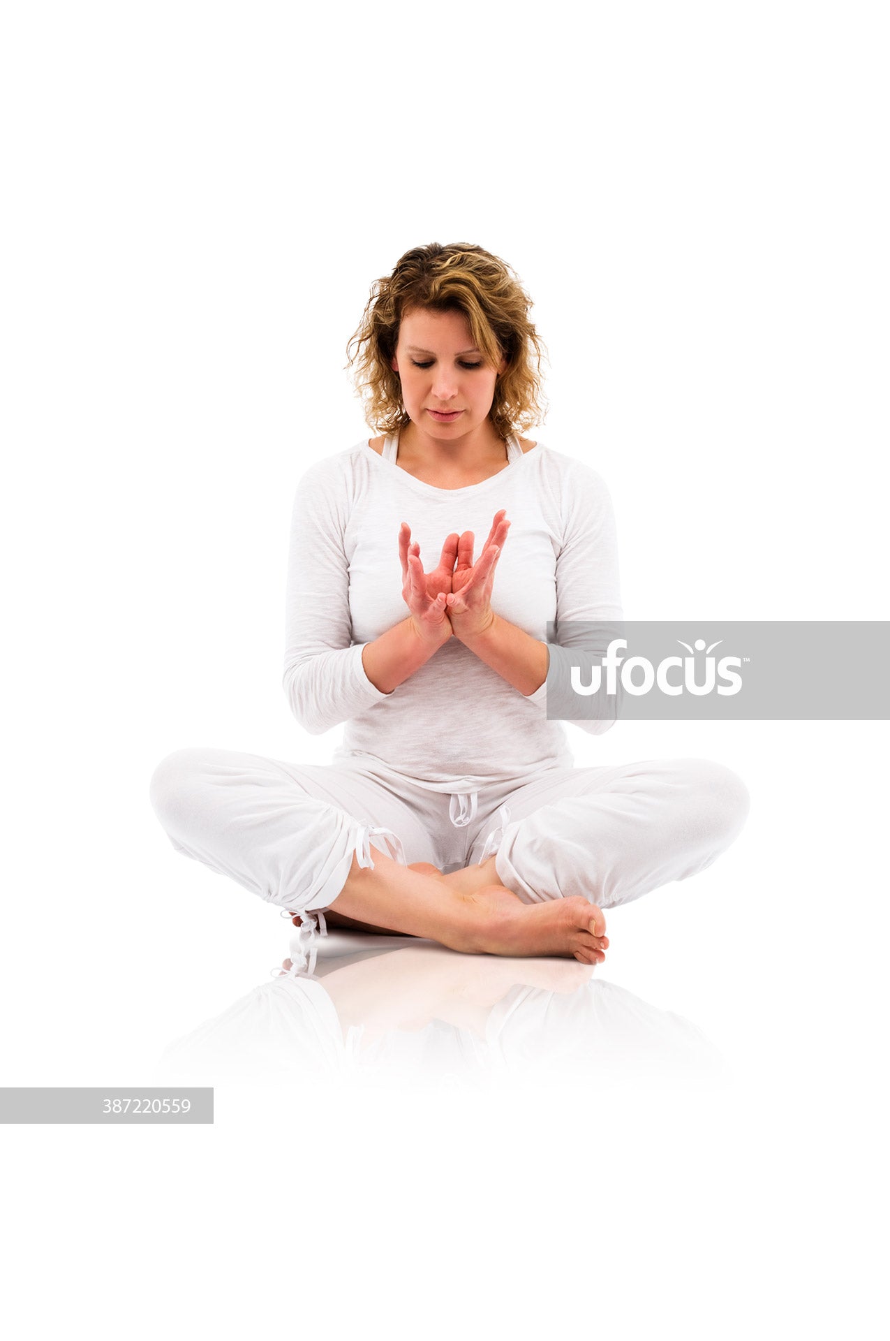 Woman practicing yoga and meditation stock photo