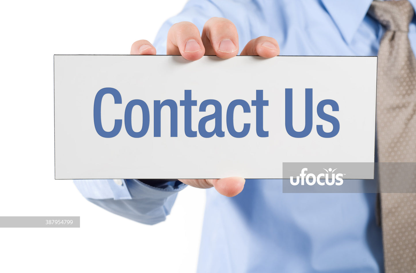 Businessman holding contact us sign stock photo