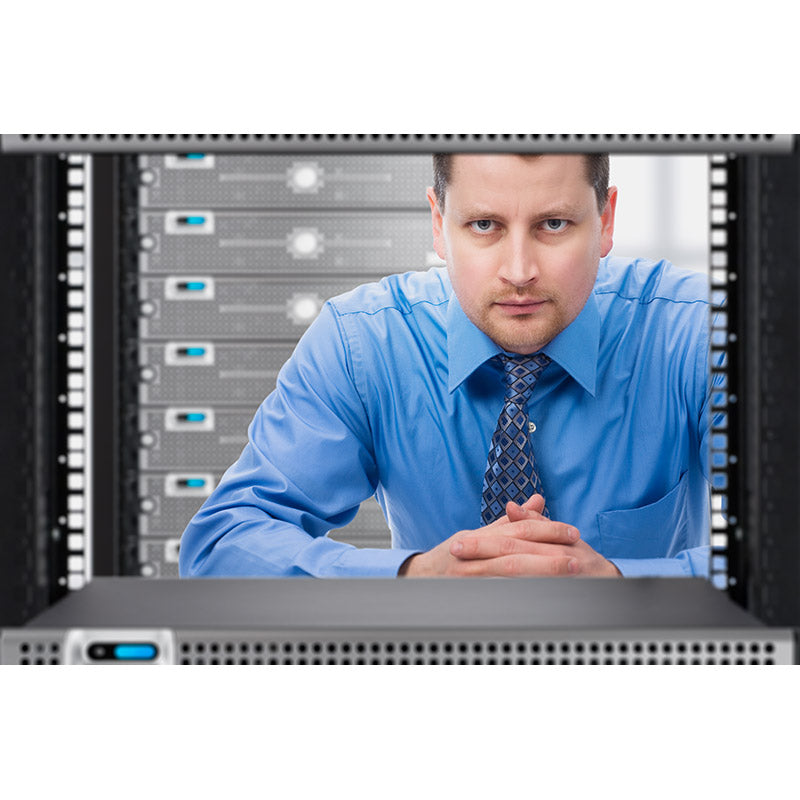 Network Administrator looking through network server rack