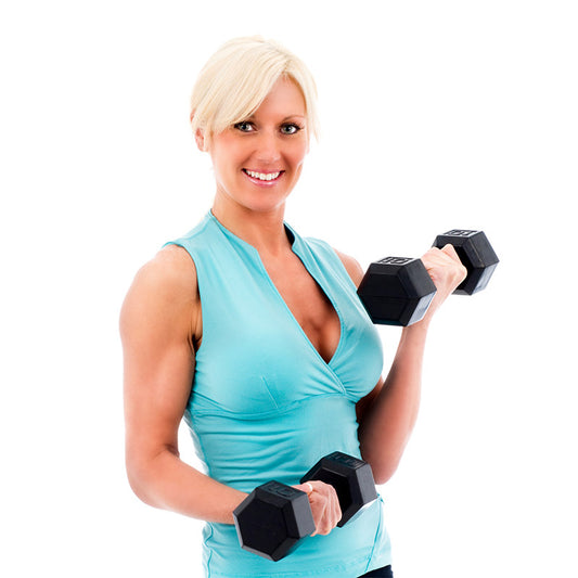Beautiful female fitness model holding weights stock photo