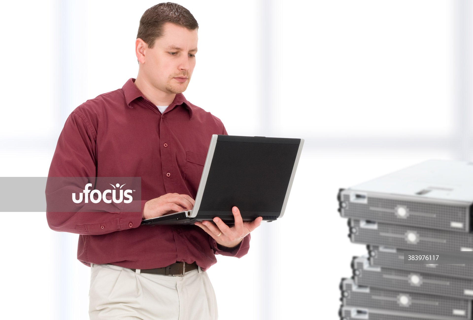 IT professional configuring network servers stock photo