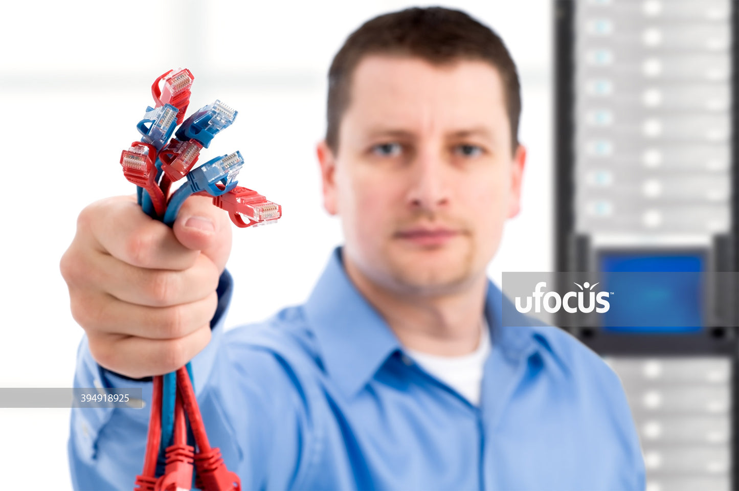 IT support professional holding network cables